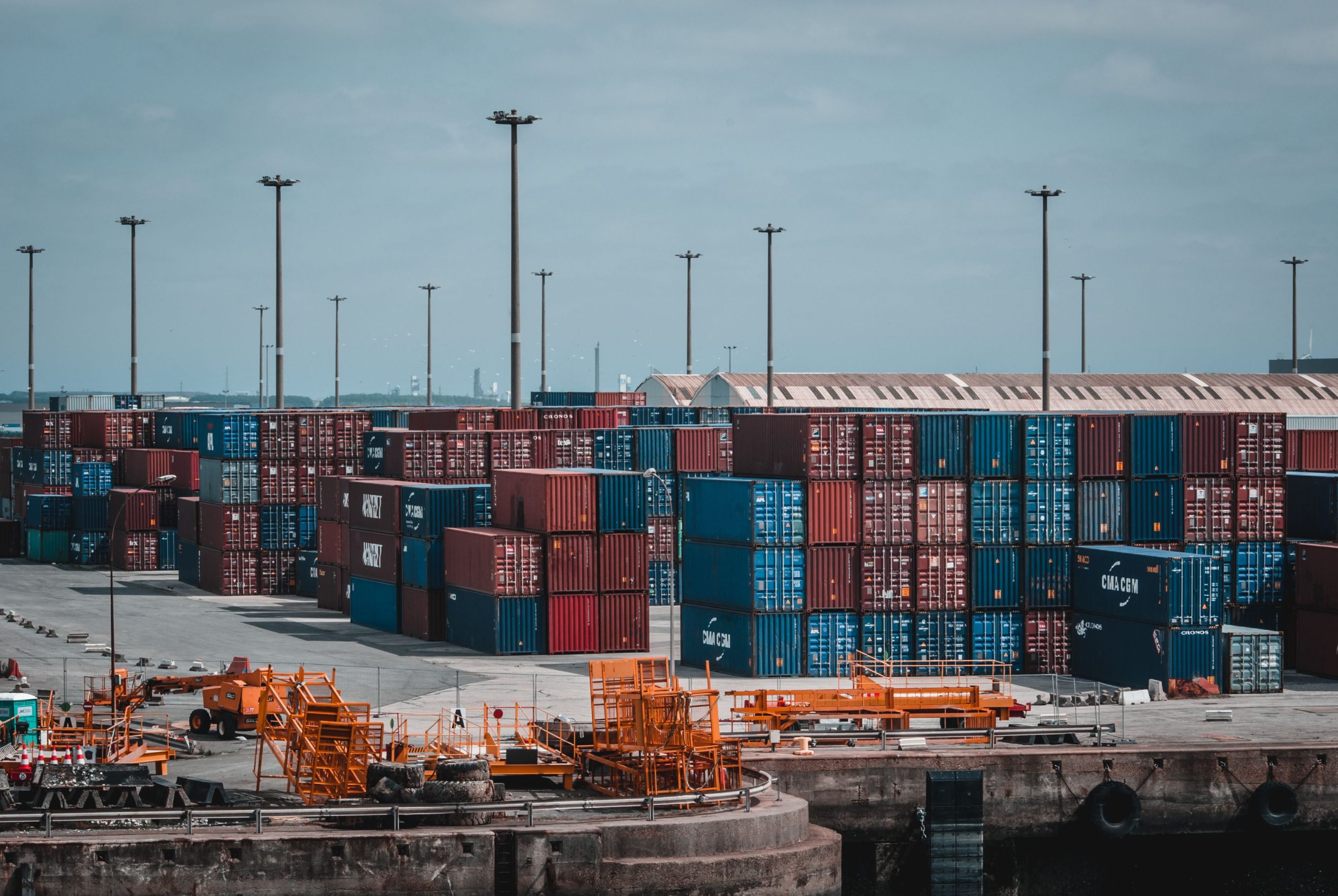 Tradeproofs Regulatory Coverage — Shipping Container Terminal and Port Logistics Shipping container terminal and industrial port logistics under cool overcast daylight — forensic verification for EU importers and ASEAN exports